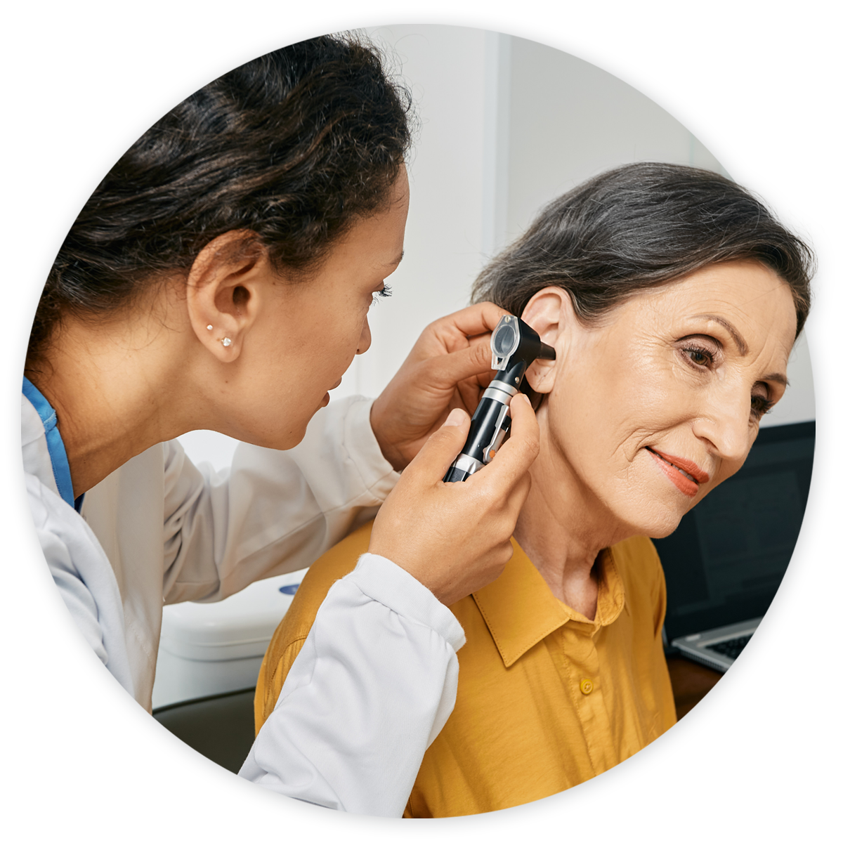 ENT-Hero Otolaryngologist examining female patient's ears