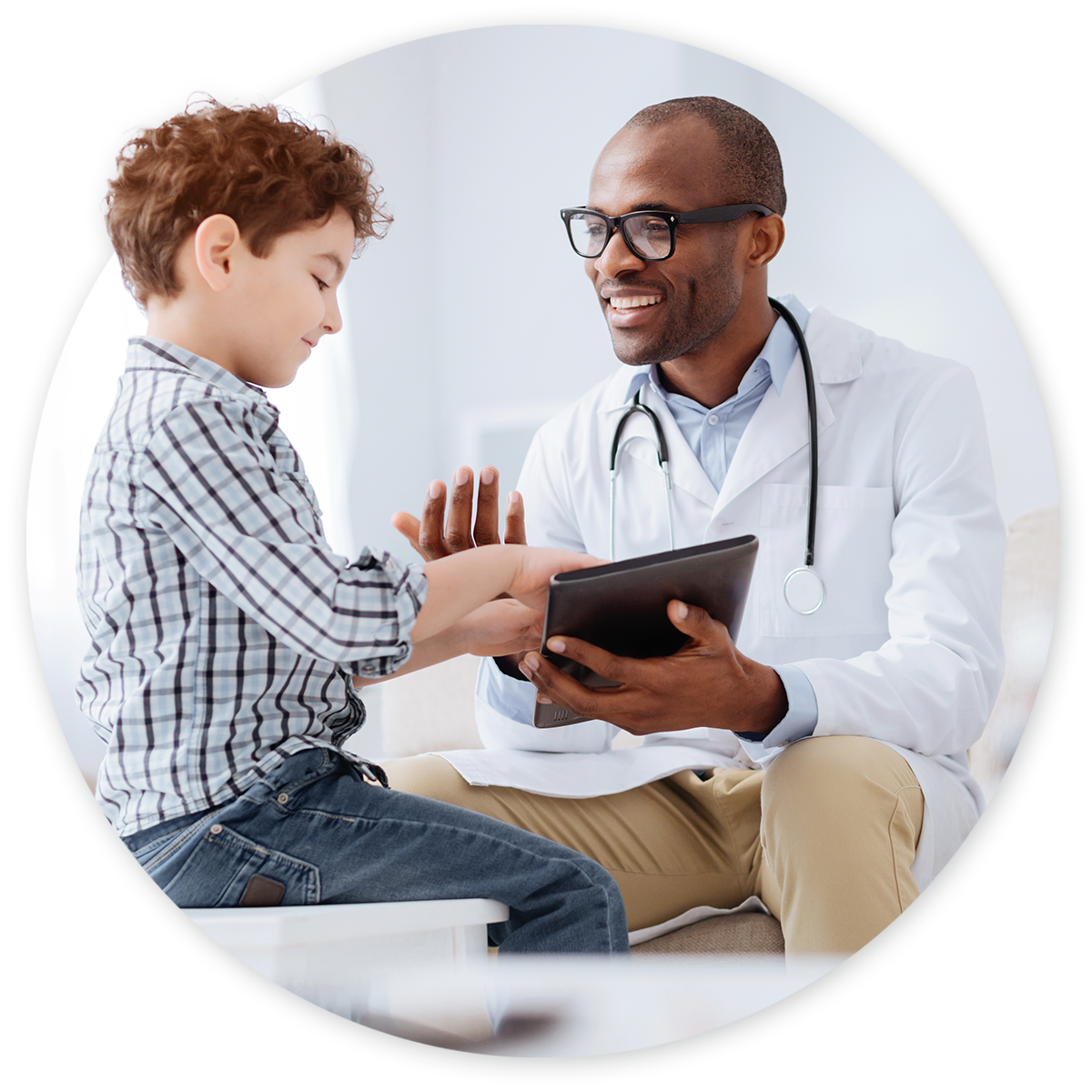 Pediatrics Hero Doctor examining toddler at pediatric appointment