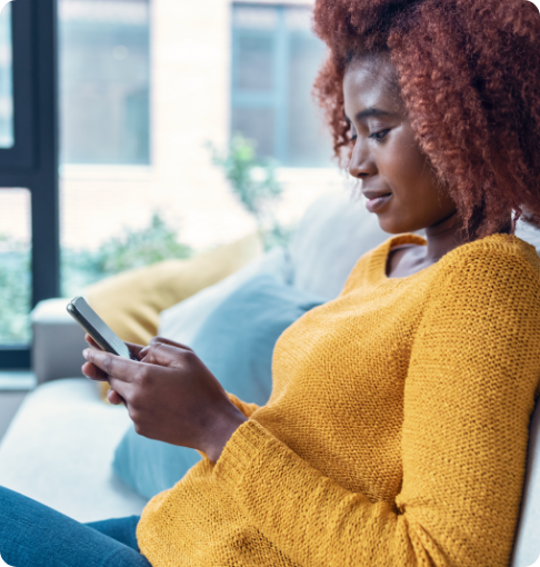 Female patient using phone to self-schedule OB/GYN appointment