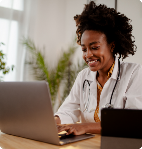 1-analytics-registration Front desk worker using Phreesia's medical scheduling software on computer