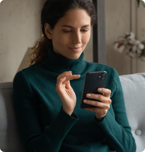 Female patient looking at phone and engaging with targeted health campaign