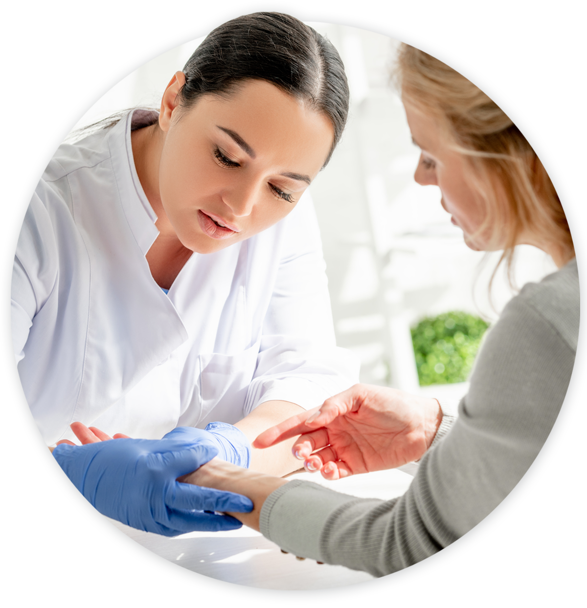 dermatology-hero Dermatologist examining female patients wrist for skin disorder