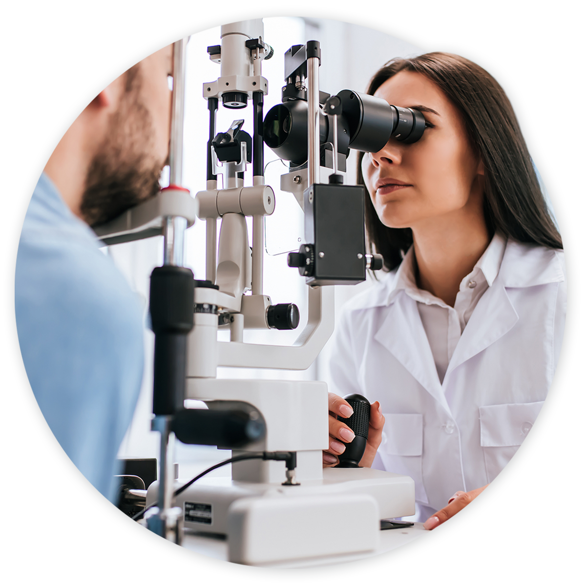 Ophthalmologist examining patient's eyes