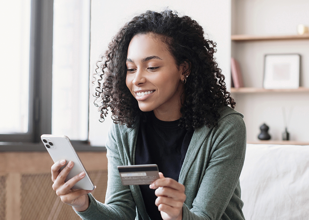 Woman of color on her phone