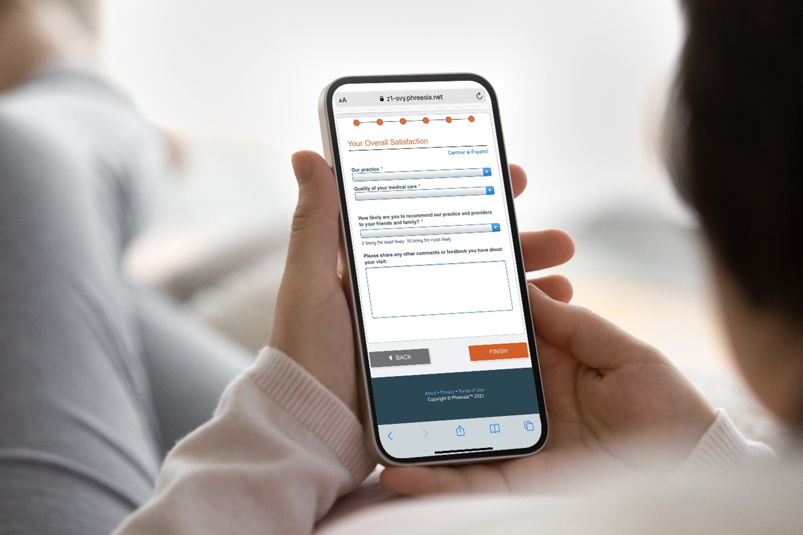 a patient looking at a post-visit satisfaction survey on a mobile phone