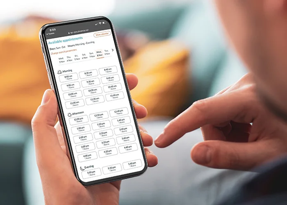 patient looking at open appointment slots on a mobile phone