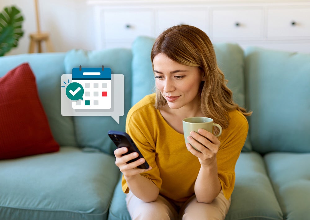 woman looking at calendar on phone