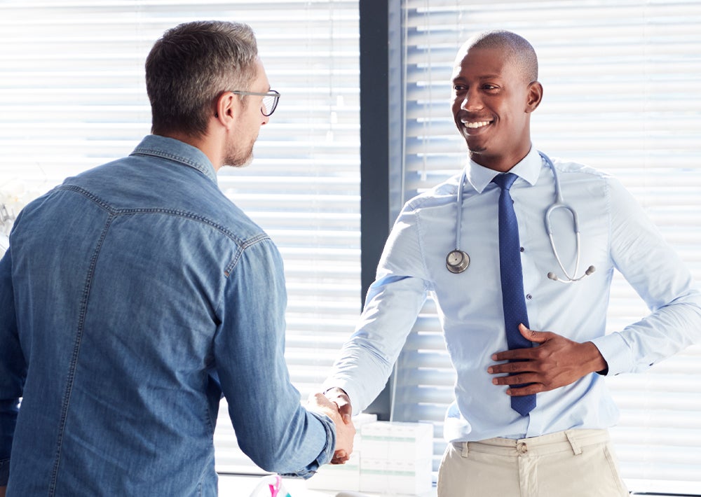 Doctor shaking hands with patient