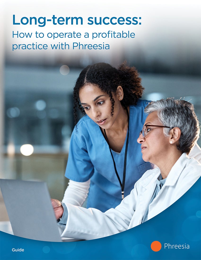Two women looking at a laptop screen. One woman is wearing blue nurse scrubs, and the other is wearing a white-colored jacket. The woman wearing the jacket is pointing at something on the laptop screen. In the top-left, there is a text overlay that says "Long-term success: How to operate a profitable practice with Phreesia"