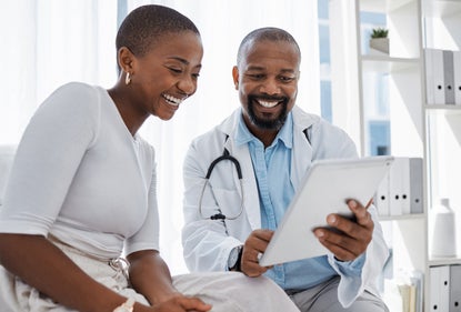 Doctor talking to patient using Phreesia intake tools