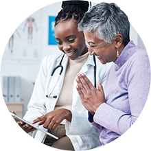 Doctor talking to patient with tablet