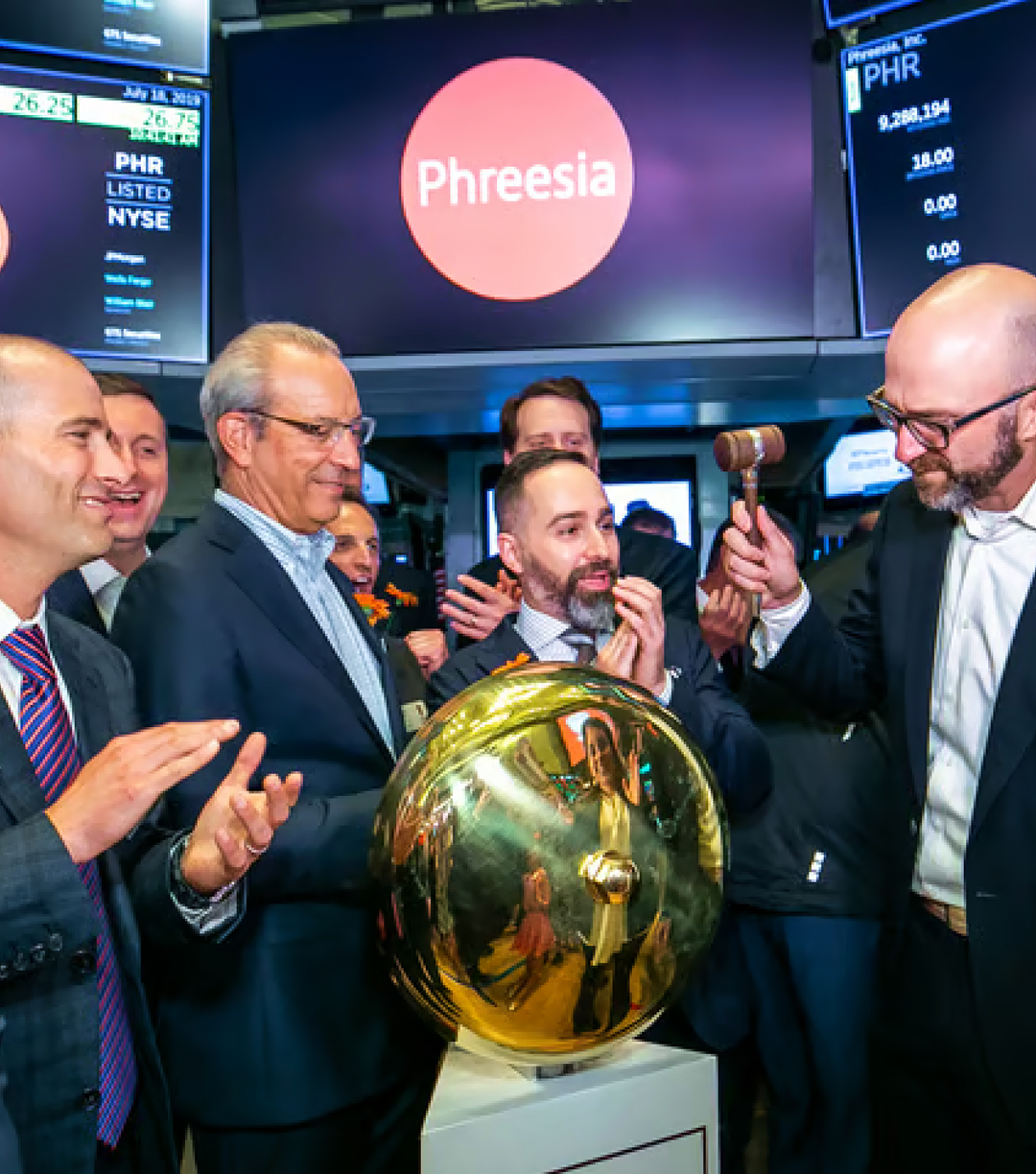 CEO Chaim Indig ringing the bell at Phreesia's IPO