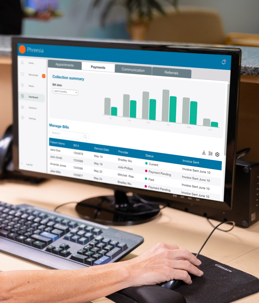 Phreesia dashboard on desktop computer with hand navigating mouse