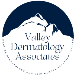 Valley Dermatology Associates logo featuring a snow-capped mountain peak with text "Valley Dermatology Associates" and tagline "Medical dermatology and skin cancer treatment center" in a circular dark blue design