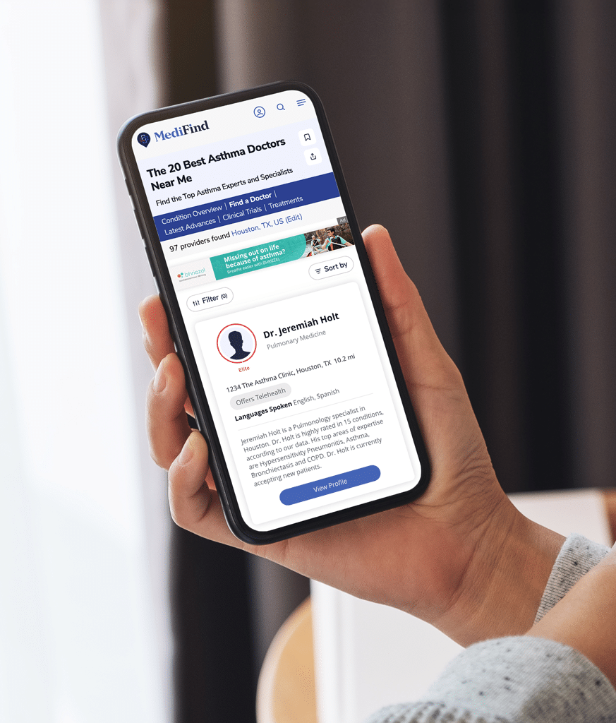 hand holding cell phone with Medifind provider search on screen